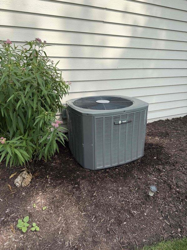 Completed comprehensive BFMA tune-up service on residential HVAC system including air conditioning unit, water heater, and additional equipment. Performed preventive maintenance on 16+ year old outdoor condenser unit, inspecting all mechanical components, electrical connections, and refrigerant levels. Documented equipment condition with photographic records showing exterior condenser installation and internal system components during diagnostic evaluation.