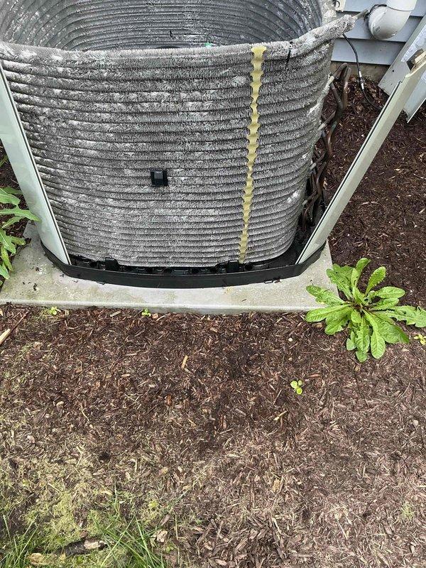 Completed comprehensive BFMA tune-up service on 12-year-old residential air conditioning system. Inspected indoor air handler unit and documented heavily soiled air filter with significant dust accumulation requiring replacement. Evaluated outdoor condensing unit with weathered coil fins showing debris buildup and discoloration; coils displayed typical outdoor exposure with mulch, leaves, and organic matter accumulation around unit perimeter on concrete pad.