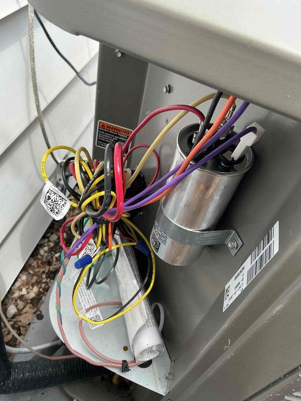 Completed comprehensive BFMA tune-up on 8-month-old HVAC system including air conditioning service and semi-annual filter change. Inspected all electrical components including capacitor, wiring harness, and control connections; verified proper operation of all circuits. Examined outdoor unit condensate drain pans, noting normal weathering and minor surface oxidation consistent with equipment age; confirmed drainage functioning properly and refrigerant lines secure.
