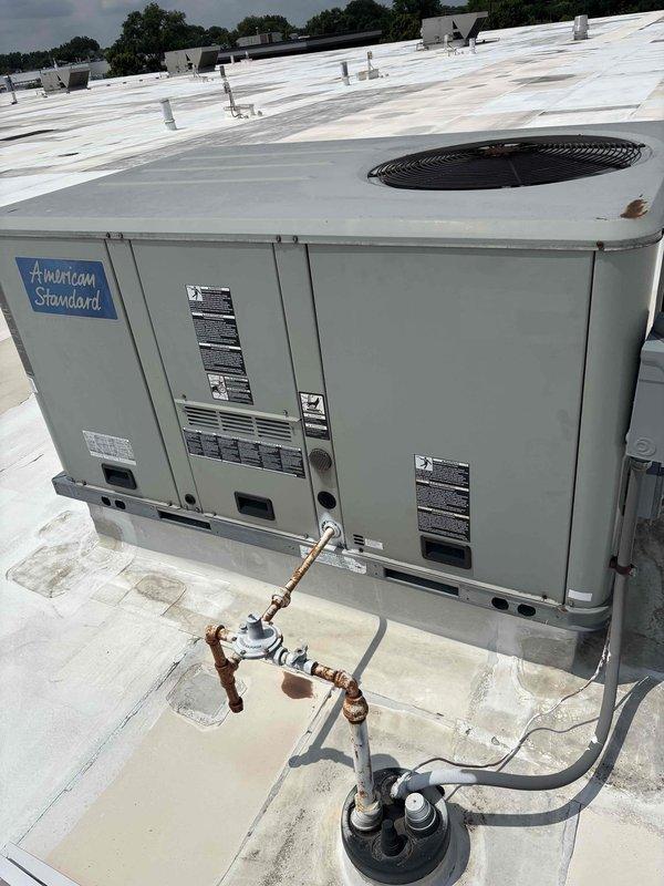Completed scheduled BFMA preventive maintenance tune-up on commercial rooftop unit, including replacement of nine filters across lower level RTUs. Performed routine inspection of American Standard packaged air conditioning system, verified refrigerant lines and connections, and documented equipment condition with photographic records of rooftop installations and surrounding infrastructure.