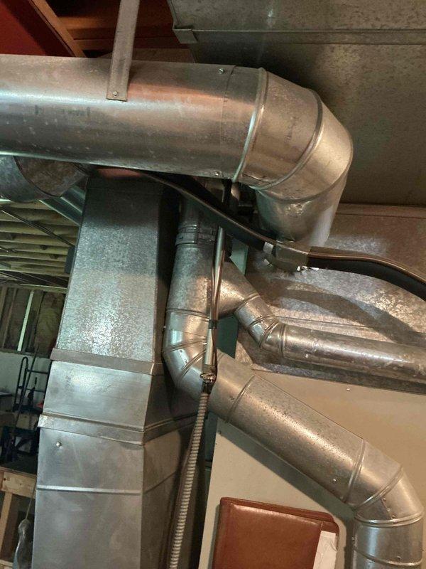 Completed comprehensive HVAC estimate for replacement of 30+ year old air conditioning system and evaporator coil. Client's existing equipment had failed completely, leaving property without cooling capabilities. Assessed current furnace and ductwork configuration in basement utility area, documenting existing galvanized ductwork system and copper refrigerant line routing. Provided recommendations for new AC condenser unit and compatible indoor evaporator coil to integrate with existing forced-air system, prioritizing expedited installation timeline due to urgent cooling needs.