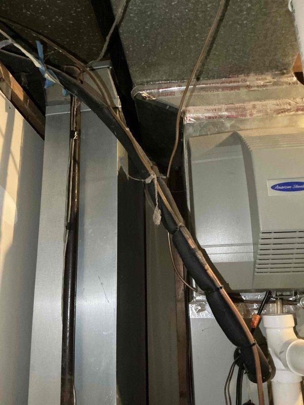 Responded to no-heat call for flooded HVAC system in basement utility area. Assessed existing American Standard furnace and air conditioning unit, both requiring replacement due to water damage. Documented equipment conditions and surrounding ductwork configuration, noting previous evaporator coil replacement from service history. Scheduled full system replacement estimate appointment to propose appropriate equipment sizing and comfort solutions for the home.