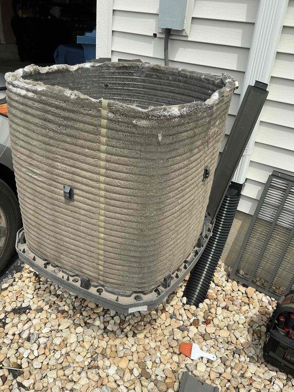 Completed comprehensive BFMA tune-up service on a 5-year-old residential air conditioning system. Upon arrival, found the outdoor condenser unit operating without its protective housing, resulting in severe debris accumulation on the coil fins. Performed thorough cleaning of the condenser coil to remove heavy dirt, dust, and environmental buildup that had significantly compromised airflow and heat transfer efficiency. Inspected all accessible components, verified electrical connections at the junction box, and confirmed proper system operation. Unit restored to optimal performance standards with improved airflow through cleaned coil assembly.