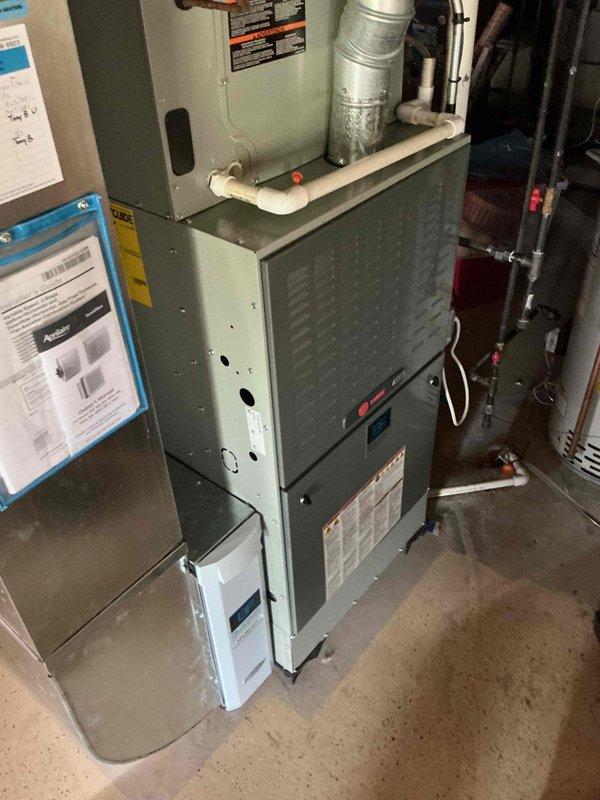 Completed comprehensive BFMA tune-up service on residential HVAC system with 5-year-old equipment. Performed full air conditioning maintenance protocol including inspection of furnace unit, blower motor assembly, electrical connections, and ductwork. Verified proper operation of all mechanical components, checked refrigerant lines, inspected copper motor housing and wiring connections, and confirmed adequate airflow through corrugated duct system. System operating within normal parameters with no issues identified.