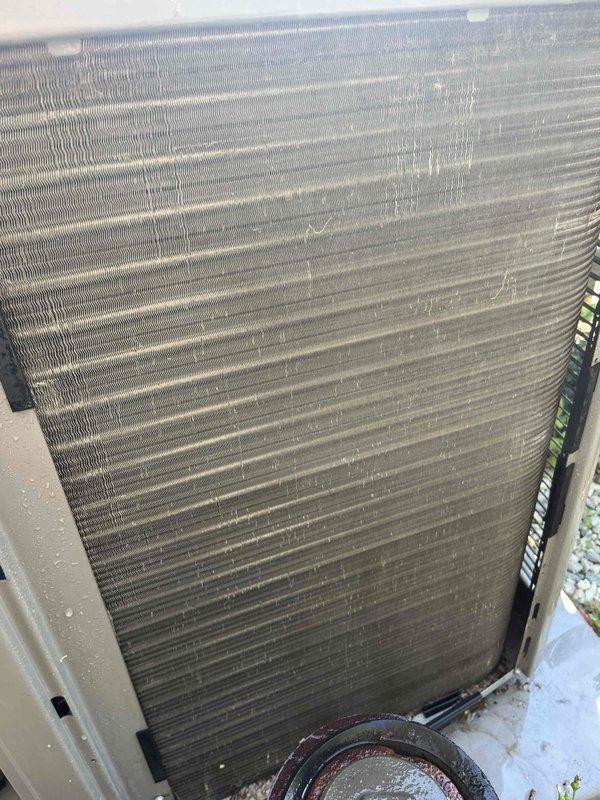 Performed comprehensive BFMA tune-up on 2+ year old air conditioning system. Upon arrival, found condenser coil heavily contaminated with dirt, dust, and organic debris accumulation affecting heat transfer efficiency. Completed full system inspection including cleaning of condenser coils, verification of refrigerant pressures, electrical connections inspection, and operational testing. Unit restored to proper working condition with improved airflow through coils and optimal performance parameters confirmed.