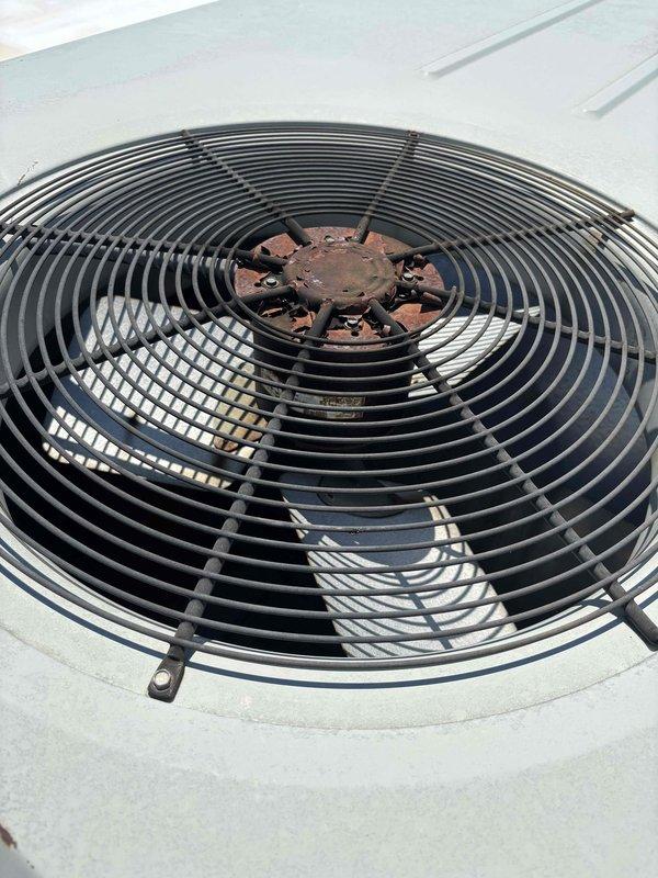 Responded to service call for RTU #7 experiencing fan motor failure. Upon inspection, identified failed run capacitor preventing fan motor operation. Replaced defective capacitor with new unit from truck stock, restoring proper fan operation. Verified system functionality and confirmed unit returned to normal cooling operation.