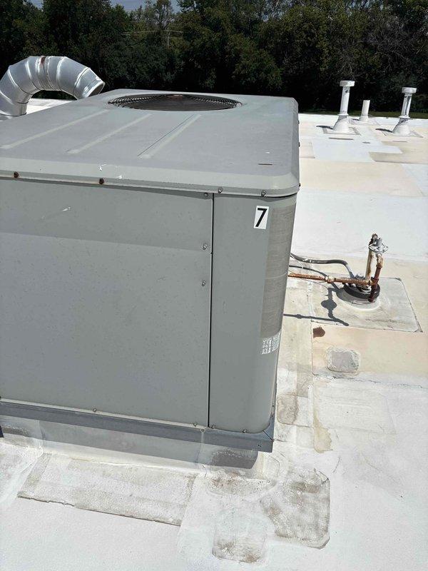 Responded to service call for RTU #7 experiencing fan motor failure. Upon inspection, identified failed run capacitor preventing fan motor operation. Replaced defective capacitor with new unit from truck stock, restoring proper fan operation. Verified system functionality and confirmed unit returned to normal cooling operation.
