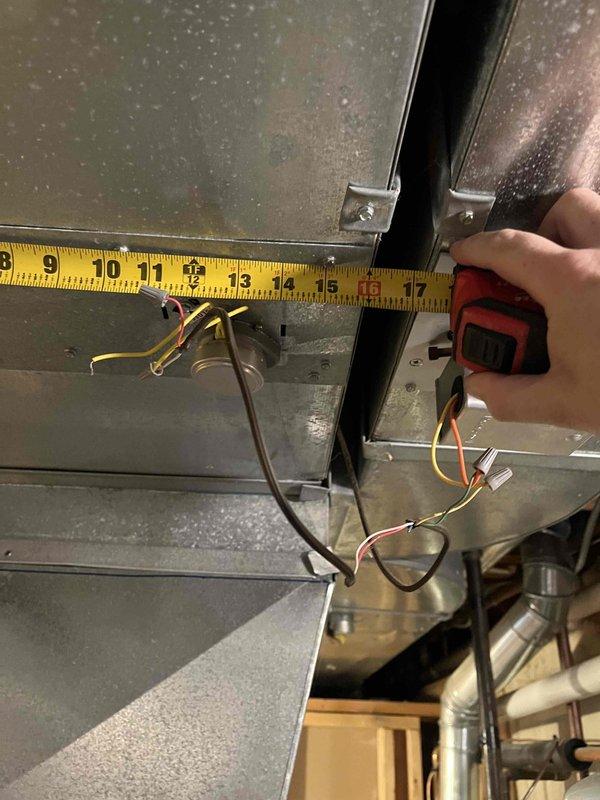 Responded to customer report of squeaking noise from basement air conditioning unit. Performed diagnostic inspection of indoor equipment and ductwork system. Inspected blower assembly, motor bearings, and belt drive components for signs of wear or misalignment. Examined sheet metal ductwork connections and support brackets for loose fasteners or metal-to-metal contact that could produce noise. Verified electrical connections and wiring at unit were secure. Documented system condition with measurements and photographs of ductwork and mechanical components for service records.
