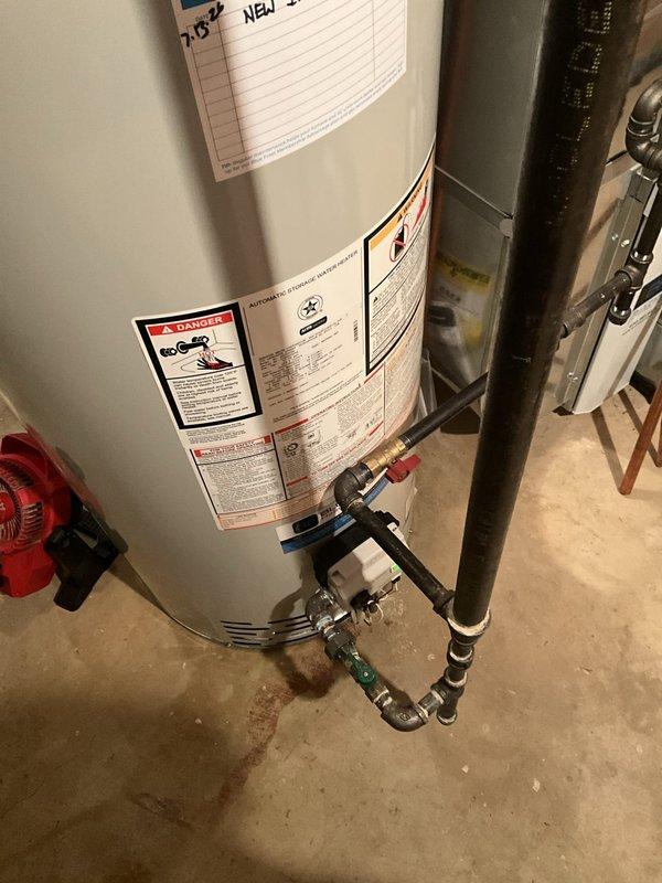 Completed installation of a 50-gallon Bradford White tanked water heater in basement utility area. Unit was properly positioned, connected to existing plumbing lines with appropriate inlet and outlet piping, and integrated with HVAC ductwork. All connections were secured with code-compliant fittings, safety valves installed, and system tested for proper operation and leak-free performance.