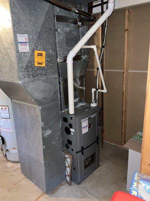 Completed comprehensive BFMA tune-up service on residential HVAC system located in basement utility area. Performed standard air conditioning maintenance protocol including system inspection, replaced heavily soiled air filter with accumulated dust and debris, checked furnace operation and PVC condensate drainage lines, and verified proper airflow through plenum and ductwork. All equipment found to be operating within normal parameters upon completion of preventive maintenance service.