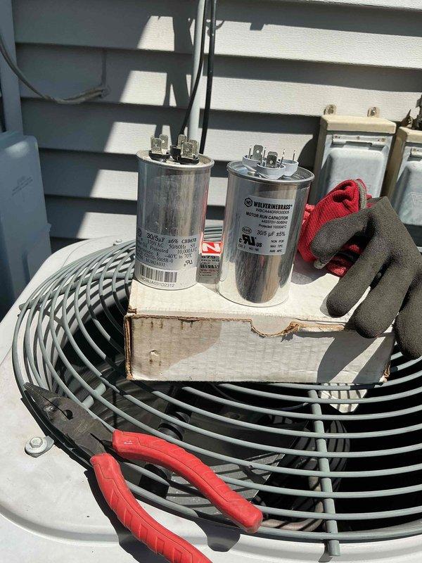 Replaced failed outdoor condenser fan motor and dual run capacitor on residential air conditioning unit. Removed defective components, installed new OEM replacement fan motor and capacitor, verified proper electrical connections and system operation upon completion.