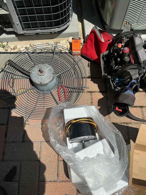 Replaced failed outdoor condenser fan motor and dual run capacitor on residential air conditioning unit. Removed defective components, installed new OEM replacement fan motor and capacitor, verified proper electrical connections and system operation upon completion.