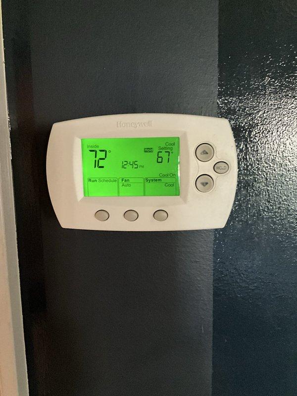 Completed comprehensive BFMA tune-up on 10+ year old air conditioning system, arriving after 1PM as requested. Performed full system inspection including thermostat verification (confirmed cooling operation at 72°F with 67°F setpoint), inspected and tested electrical components including contactor and capacitor, replaced air filter, and verified all connections and system operations. All components found in serviceable condition with normal wear for equipment age, system operating within manufacturer specifications.
