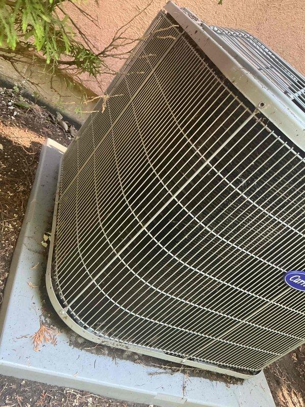 Completed comprehensive BFMA tune-up on 5-year-old residential air conditioning system per customer request for afternoon service. Performed standard maintenance protocol including inspection of outdoor condensing unit, which revealed significant rust and corrosion on interior base pan and compressor mounting area, along with heavily soiled condenser coil and top grille guard with accumulated debris and environmental contamination. Documented equipment condition with detailed photographs showing deteriorated metal surfaces, oxidized components, and reduced heat transfer efficiency due to dirty coil fins. System remains operational following tune-up procedures, though visible corrosion and debris accumulation indicate need for ongoing monitoring of unit longevity and performance.