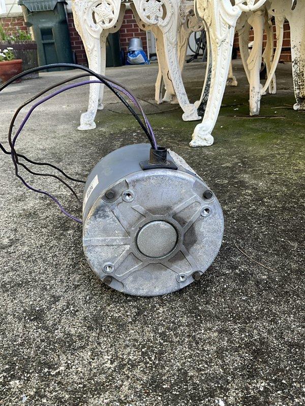 Completed warranty replacement of condenser fan motor on rooftop HVAC unit. Removed failed motor assembly from outdoor condensing unit, disconnected electrical connections, and installed new OEM replacement motor. Verified proper shaft alignment, secured mounting hardware, reconnected wiring per manufacturer specifications, and tested unit operation to confirm proper fan rotation and system functionality. Old motor removed from site and disposed of properly.