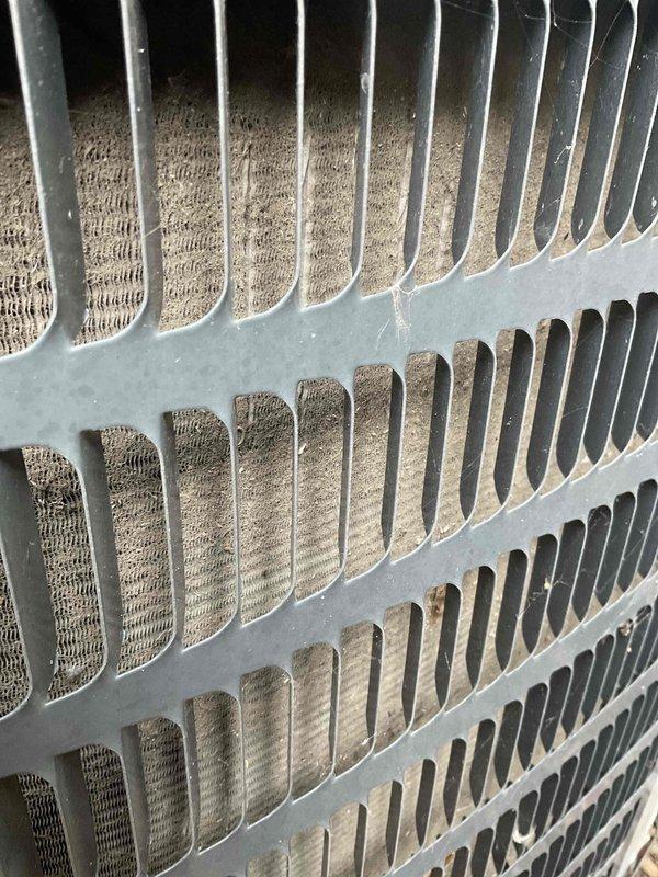Completed comprehensive BFMA tune-up service on a 10+ year old air conditioning system, including full inspection and maintenance of condenser unit. Documented condenser coil condition showing moderate dust and debris accumulation between fins, with visible buildup affecting heat transfer efficiency. Performed standard tune-up procedures to ensure optimal system performance for the cooling season.