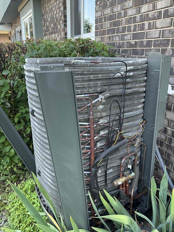 Completed comprehensive BFMA tune-up service on residential air conditioning system aged 2+ years. Performed standard maintenance protocol including inspection of condenser unit, verification of refrigerant line integrity, examination of electrical connections and wiring harness, and assessment of condenser coil condition. Unit accessed via rear panel removal, all components found operational with normal weathering consistent with outdoor exposure, system returned to service in proper working condition.