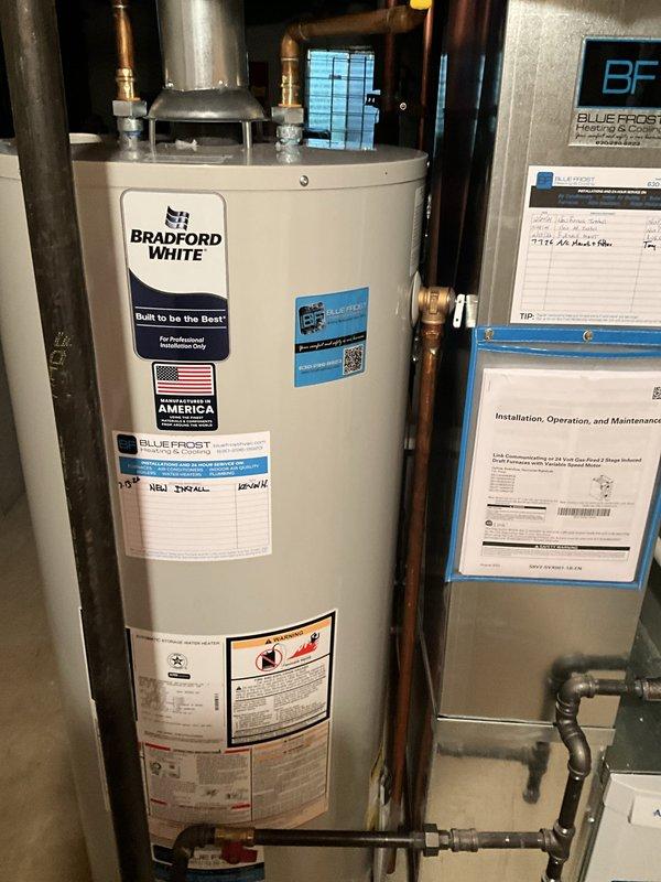Responded to service call for Bradford White tanked water heater installation issue. Upon inspection, identified that pressure release valves were positioned too close to the air return ductwork, creating insufficient clearance for proper operation and code compliance. Documented existing conditions with photographs showing water heater, copper piping connections, and HVAC ductwork proximity. Will need to return to relocate pressure relief valve or adjust ductwork positioning to achieve adequate clearance and ensure safe operation of safety mechanisms.