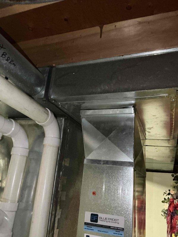 Conducted sales estimate for HVAC system replacement at residential property where existing air conditioning and coil unit are currently operational but experiencing performance issues. Evaluated electrical panel capacity, inspected existing air handler and ductwork in basement utility area, documented equipment condition including galvanized metal air handler with connected PVC drainage lines and flexible ductwork, and assessed system infrastructure to provide comprehensive replacement recommendations for improved cooling efficiency and reliability.