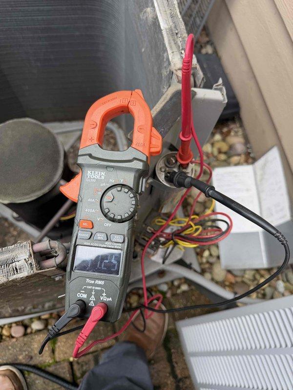 Completed comprehensive tune-up on two 14-year-old air conditioning units. Performed electrical diagnostics using clamp meter to verify proper amperage and voltage readings at compressor and electrical components. Replaced air filters and cleared debris accumulation from unit interior to ensure optimal airflow and system efficiency.