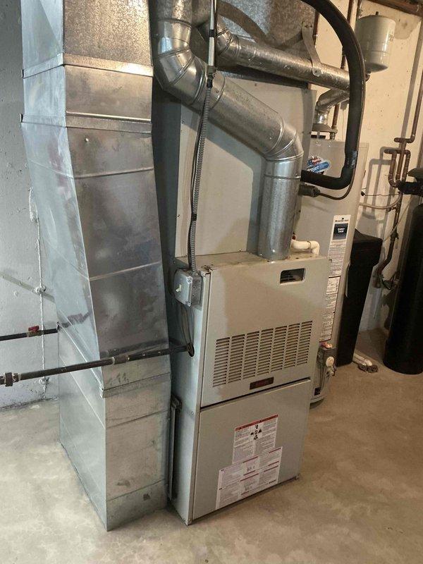 Completed standard full HVAC system installation consisting of an SL280UH110V60CK furnace and ML13KC1-048 air conditioning condenser unit with CK40CT-48C evaporator coil. Utilized existing electrical breaker, return air drop, and filter cabinet while reinstalling the existing thermostat without requiring a new disconnect. All ductwork connections were properly secured to the new furnace unit, refrigerant lines were run and connected between the indoor and outdoor components, and the system was tested for proper operation upon completion.