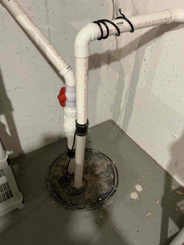 Completed comprehensive BFMA tune-up service on a Carrier air conditioning unit aged 6+ years. Performed standard AC maintenance protocol including inspection of outdoor condenser unit, which showed moderate accumulation of debris and dirt between wire grille sections requiring attention. Inspected associated condensate drainage system with PVC piping configuration and verified proper flow control valve operation.