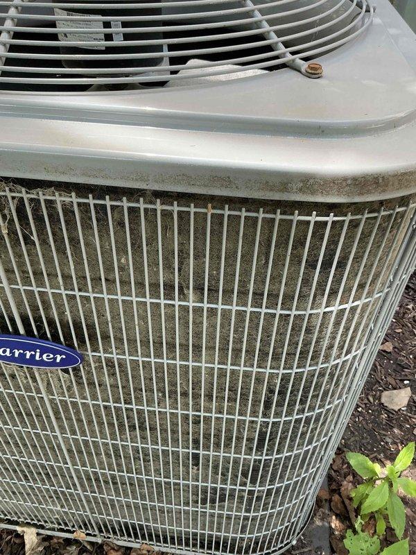 Completed comprehensive BFMA tune-up service on a Carrier air conditioning unit aged 6+ years. Performed standard AC maintenance protocol including inspection of outdoor condenser unit, which showed moderate accumulation of debris and dirt between wire grille sections requiring attention. Inspected associated condensate drainage system with PVC piping configuration and verified proper flow control valve operation.