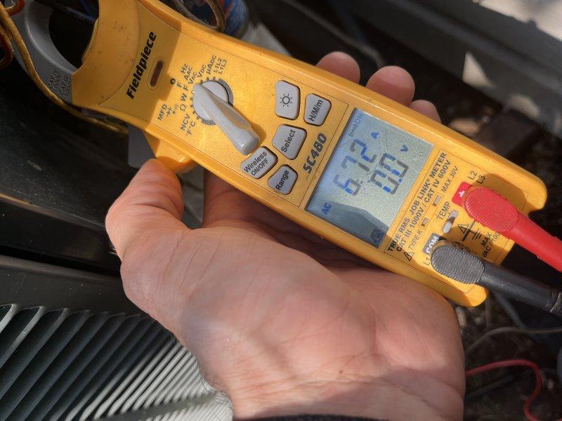 Completed comprehensive BFMA preventive maintenance tune-up on 9-year-old air conditioning system during scheduled afternoon appointment. Performed full system diagnostics including electrical testing with digital multimeter, recording voltage and amperage readings at condenser unit to verify proper compressor operation and electrical performance within manufacturer specifications. Inspected condenser coil condition, verified refrigerant pressures, and documented all measurements to ensure optimal system efficiency and reliability for continued operation.
