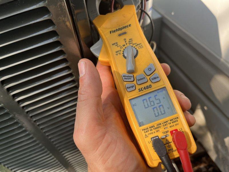 Completed comprehensive BFMA preventive maintenance tune-up on 9-year-old air conditioning system during scheduled afternoon appointment. Performed full system diagnostics including electrical testing with digital multimeter, recording voltage and amperage readings at condenser unit to verify proper compressor operation and electrical performance within manufacturer specifications. Inspected condenser coil condition, verified refrigerant pressures, and documented all measurements to ensure optimal system efficiency and reliability for continued operation.