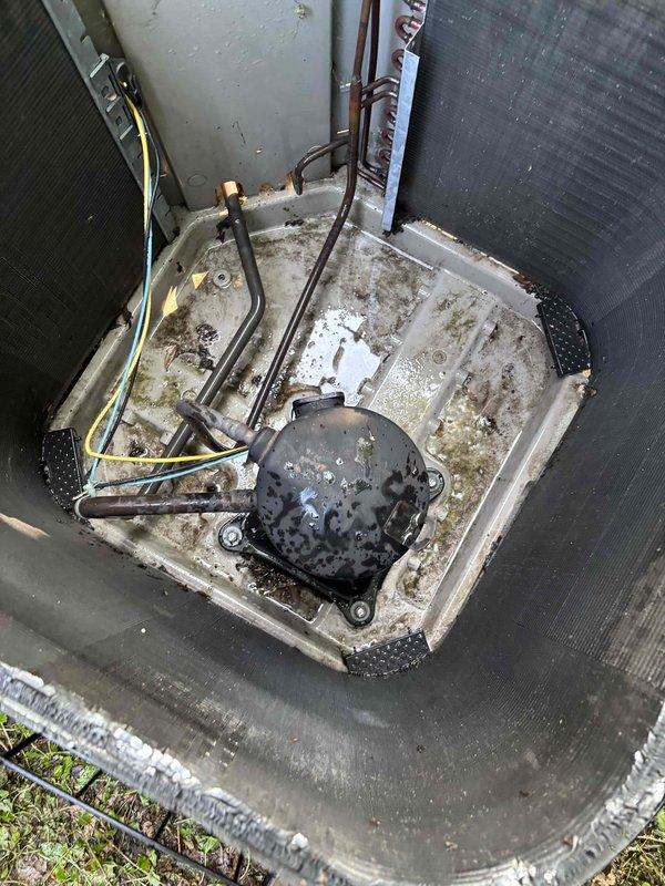 Completed comprehensive BFMA tune-up service on 16+ year old outdoor AC unit. Performed thorough system inspection, replaced heavily soiled air filter with proper 113 specification filter, cleaned condenser coils showing significant debris accumulation, and verified refrigerant line connections and electrical components. Unit exhibited extensive weathering with oxidized copper lines, mineral deposits in drain pan, and substantial dirt buildup; all maintenance items addressed per BFMA protocol to restore optimal system performance.