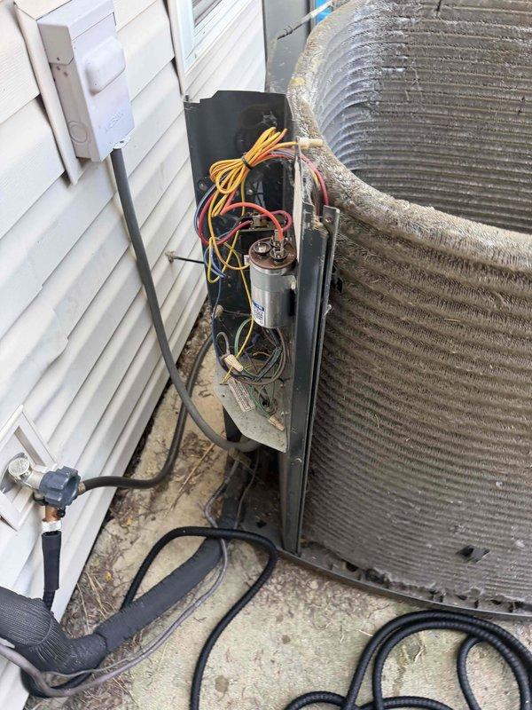 Completed comprehensive BFMA tune-up service on a 5-year-old outdoor air conditioning unit. Upon arrival, found condenser coils heavily clogged with dirt, dust, and debris accumulation that was significantly restricting airflow and reducing system efficiency. Performed thorough coil cleaning to remove all debris buildup from fins, inspected all electrical connections and wiring including capacitor, checked refrigerant line connections, and verified proper system operation. Unit is now operating at optimal efficiency with restored airflow through clean condenser coils.