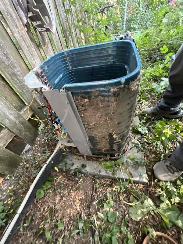 Completed comprehensive BFMA tune-up service on a 6-year-old residential air conditioning system. Upon arrival, found the outdoor condensing unit heavily soiled with mud, dirt, and organic debris, with overgrown vegetation encroaching on the equipment. Performed thorough cleaning of condenser coils and exterior surfaces, cleared surrounding vegetation to restore proper airflow clearance, and completed all standard preventive maintenance procedures including electrical connections inspection, refrigerant level verification, and operational testing to ensure optimal system performance.