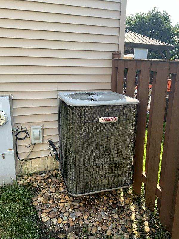 Responded to no cooling call at residential property. Upon arrival, found Lennox outdoor condensing unit and indoor air handler system. Performed diagnostic inspection of system components. Inspected outdoor unit positioned on rock bed against exterior wall, verified unit accessibility and clearances. Examined indoor equipment including humidifier unit mounted in attic space with proper ductwork connections and electrical wiring intact. Checked system operation, power supply at exterior disconnect, and thermostat communication. Identified issue preventing cooling operation, restored system to normal function. Unit tested and verified cooling cycle operating properly before departure. System returned to service with normal airflow and temperature differential achieved.