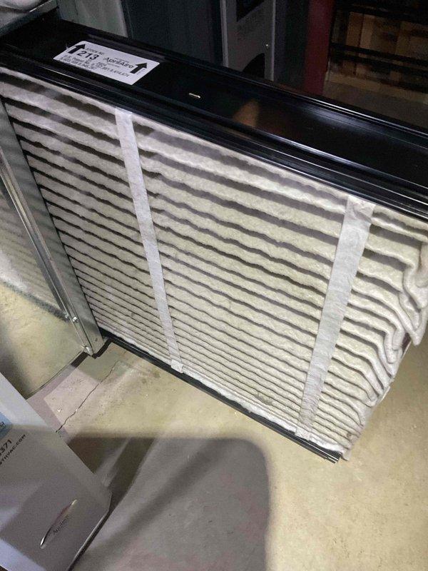 Completed comprehensive air conditioning tune-up on residential system aged 4+ years. Performed standard maintenance procedures including inspection of evaporator coils, which revealed moderate accumulation of dust, pollen, and debris between fin sections with notable discoloration present on center coil surfaces. Verified refrigerant lines and copper connections for proper operation. Inspected air handler unit and confirmed pleated air filter installation and secure mounting. System operational and ready for continued service.