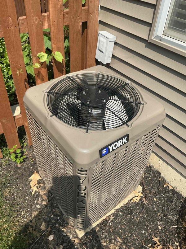 Completed comprehensive air conditioning tune-up service on York brand condensing unit. Performed standard maintenance protocol including inspection of outdoor unit components, fan operation verification, and system performance evaluation. Inspected and documented condition of 16x25x1 air filter, which showed moderate dust accumulation consistent with normal usage, and assessed overall HVAC system functionality to ensure optimal cooling performance for the upcoming season.