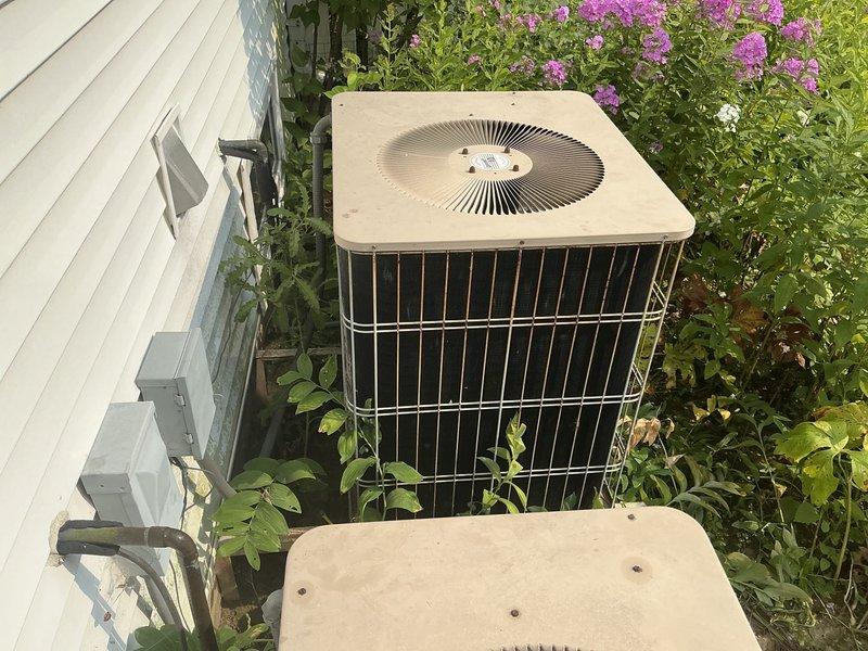 Conducted comprehensive site evaluation for full HVAC system replacement. Assessed existing Carrier furnace installation and outdoor condensing unit to determine replacement requirements and address client concerns regarding installation quality and system efficiency. Client requested high-efficiency equipment options for one or two complete systems, noting that one furnace is relatively new. Performed detailed inspection of current equipment configuration, including indoor air handler/furnace unit and exterior condensing unit. Documented existing installation conditions through photographic record, noting outdoor unit placement on concrete pad with electrical disconnect, and indoor Carrier furnace installation in mechanical closet with PVC condensate drainage. Evaluated ductwork connections, clearances, and accessibility for future installation work. Provided technical consultation addressing multiple mechanical questions regarding system efficiency ratings, equipment specifications, 