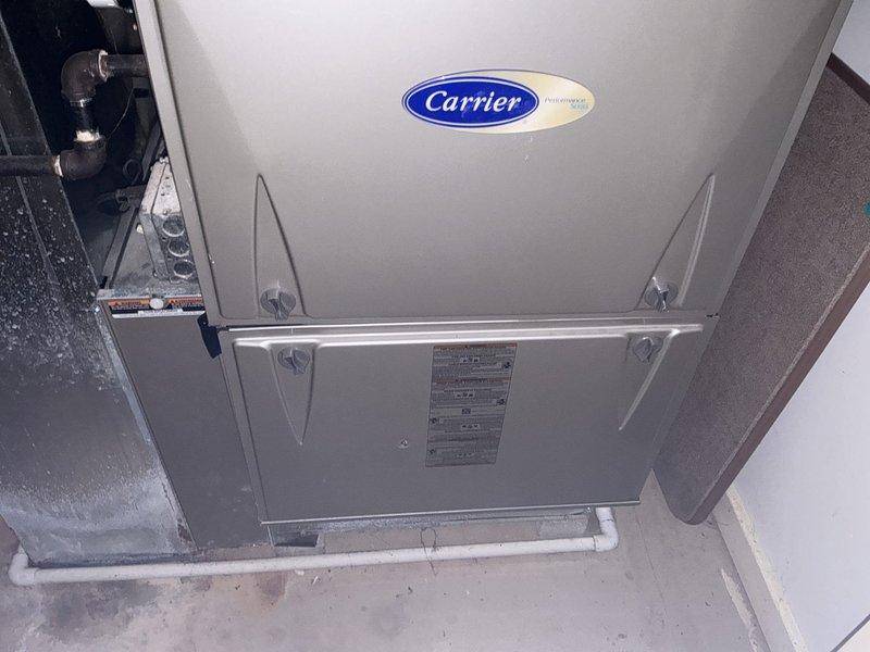 Conducted comprehensive site evaluation for full HVAC system replacement. Assessed existing Carrier furnace installation and outdoor condensing unit to determine replacement requirements and address client concerns regarding installation quality and system efficiency. Client requested high-efficiency equipment options for one or two complete systems, noting that one furnace is relatively new. Performed detailed inspection of current equipment configuration, including indoor air handler/furnace unit and exterior condensing unit. Documented existing installation conditions through photographic record, noting outdoor unit placement on concrete pad with electrical disconnect, and indoor Carrier furnace installation in mechanical closet with PVC condensate drainage. Evaluated ductwork connections, clearances, and accessibility for future installation work. Provided technical consultation addressing multiple mechanical questions regarding system efficiency ratings, equipment specifications, 