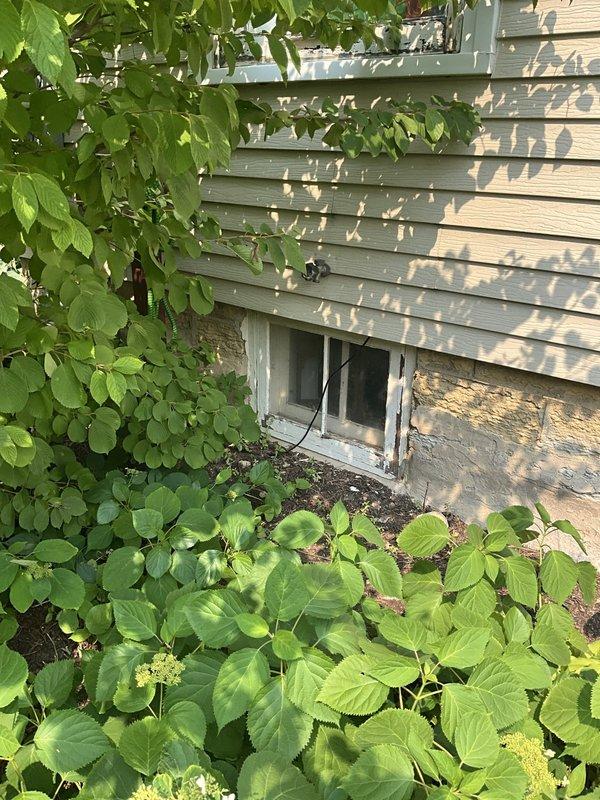 Responded to service call for leaking exterior hose spigot on side of residence. Upon inspection, identified water leakage occurring from handle assembly of outdoor faucet. Disassembled spigot valve, replaced worn packing washer and stem seal to eliminate leak at handle. Tested unit under full water pressure to verify repair integrity and confirmed no further leakage from handle or valve body.