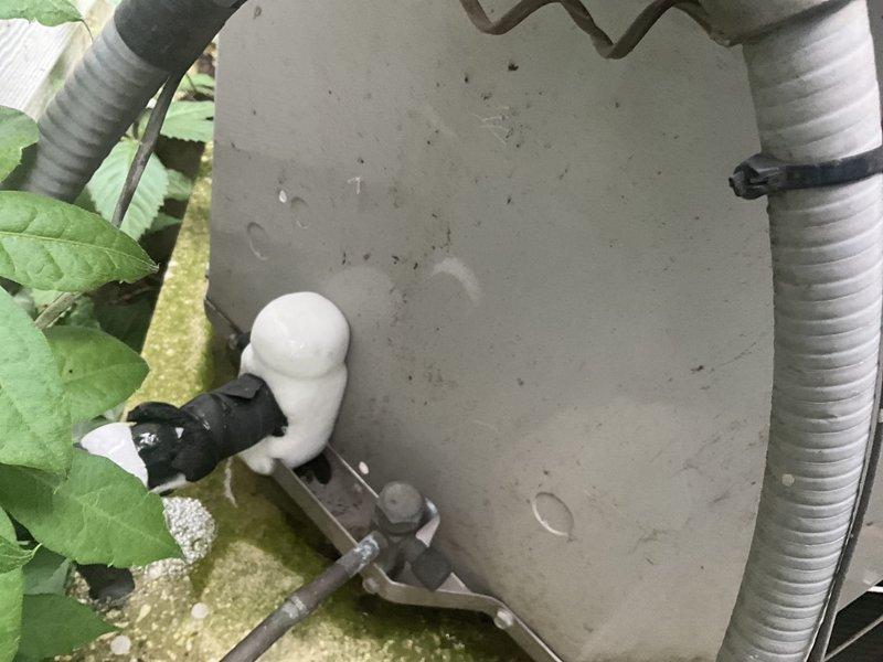 Responded to no cooling call at residential property. Upon arrival, inspected outdoor condensing unit and found condensate safety switch tripped due to blocked drain line. Cleared obstruction from condensate drain system, verified proper drainage flow, and tested float switch operation. Proceeded to indoor air handler in basement and inspected furnace/evaporator coil assembly and associated condensate piping. Confirmed all PVC drain lines were flowing freely and verified proper pitch on horizontal drain runs. Reset safety switch, restored power to system, and verified compressor startup. System tested successfully with proper cooling operation restored. Documented equipment condition with photos showing outdoor unit top panel and indoor mechanical room configuration.