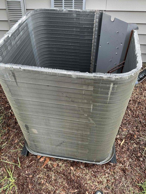 Completed comprehensive BFMA tune-up service on residential air conditioning system with equipment age of 2+ years. Performed standard AC maintenance protocol including inspection of outdoor condenser unit with ribbed metal casing, verified proper operation of internal coil assembly, and replaced indoor air filter. All components inspected and system operating within normal parameters upon completion.