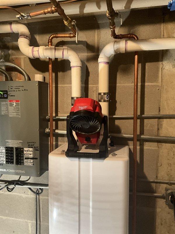 Performed comprehensive tankless water heater cleaning and flush service on residential system. Descaled heat exchanger, flushed internal components with cleaning solution, and verified proper operation of Milwaukee circulator pump and SmartPak Pro alternator control system. System tested and confirmed operational with all indicator lights functioning correctly.