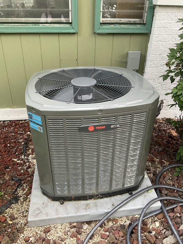 Completed comprehensive BFMA tune-up service on a Trane air conditioning system aged 2+ years. Performed full AC tune-up including inspection of outdoor condenser unit, verified proper operation of compressor and condenser fan, and checked refrigerant lines for secure connections. Replaced dirty air filter with clean unit to restore proper airflow and system efficiency.