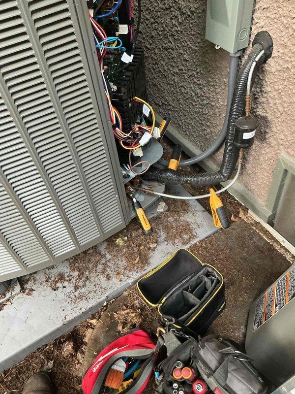 Responded to no cooling call on downstairs residential unit. Upon arrival, found thermostat indicating system running but compressor not operating. Accessed electrical compartment on outdoor condenser unit and diagnosed compressor failure. Applied lockout/tagout safety procedures and de-energized unit at disconnect box to prevent further damage to system components.