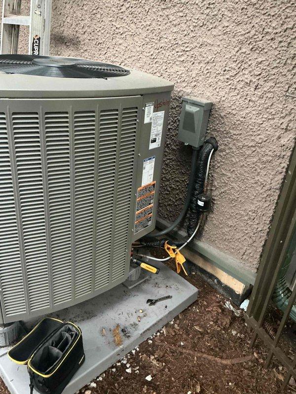 Responded to no cooling call on downstairs residential unit. Upon arrival, found thermostat indicating system running but compressor not operating. Accessed electrical compartment on outdoor condenser unit and diagnosed compressor failure. Applied lockout/tagout safety procedures and de-energized unit at disconnect box to prevent further damage to system components.