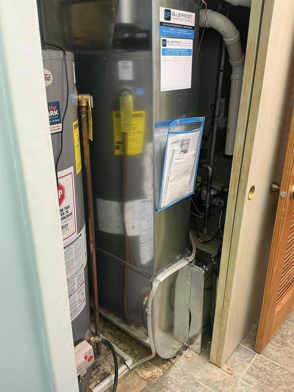 Installed 10 x 24 return drop to improve system airflow. Capped off existing ductwork behind return grille that was blocked by adjacent room obstruction. Reworked condensate drain line routing using PVC piping to ensure proper drainage and prevent future water issues.
