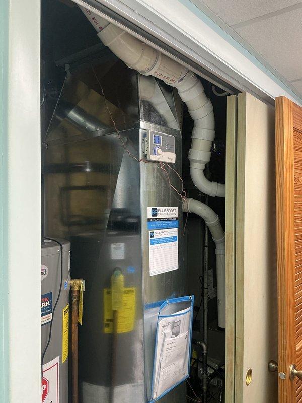 Installed 10 x 24 return drop to improve system airflow. Capped off existing ductwork behind return grille that was blocked by adjacent room obstruction. Reworked condensate drain line routing using PVC piping to ensure proper drainage and prevent future water issues.