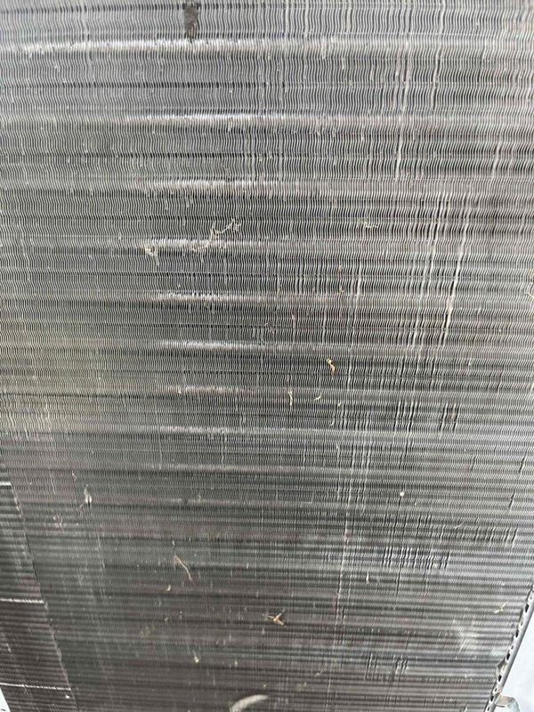 Completed comprehensive BFMA preventative maintenance tune-up on residential air conditioning system. Performed full system inspection of outdoor condenser unit, including examination of compressor operation, refrigerant lines, electrical connections, and fan motor assembly. Inspected evaporator coil and found light accumulation of dust and debris on fin surfaces; cleaned coil to restore optimal heat transfer efficiency and airflow. Verified proper refrigerant levels, checked electrical components for secure connections, and confirmed system is operating within manufacturer specifications. Unit is approximately 3 years old and functioning properly with no immediate concerns noted.
