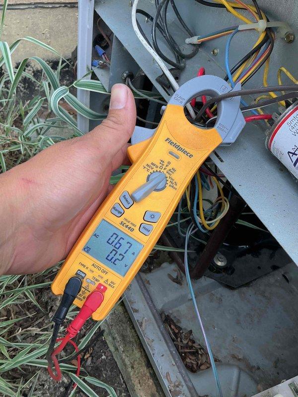 Completed comprehensive BFMA tune-up on 22-year-old Carrier Puron air conditioning system. Performed electrical diagnostics using clamp meter to verify amperage draws on blower motor and compressor circuits, inspected all wire connections and terminals, and conducted full system evaluation. Unit operating within manufacturer specifications; all components functioning properly with no immediate concerns identified.