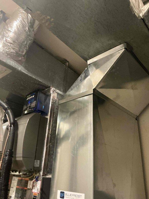 Completed full HVAC system installation including SLP99 modulating furnace and SL25 modulating air conditioning unit in attic space. Installed S40 smart thermostat with 7/8 shielded wire run to second and third floor zones, powered humidifier, and APCO UV light for air quality. Equipment outfitted with attic package components including high-rise condensate pan, eight anti-vibration pads, overflow wet switch, and condensate safety overflow switch for proper drainage protection and vibration dampening. Verified operation of existing system and confirmed all new equipment functioning correctly with proper temperature control and zone management across multiple floors.