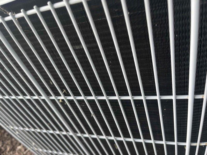 Completed comprehensive BFMA tune-up on 14-year-old air conditioning system. Performed full system inspection including condenser coil evaluation, which showed clean heat exchanger fins with proper spacing and no visible damage or deterioration. Inspected and documented air filter condition, noting accumulated dust and debris with moderate particulate buildup throughout pleated media requiring replacement for optimal airflow and system efficiency.